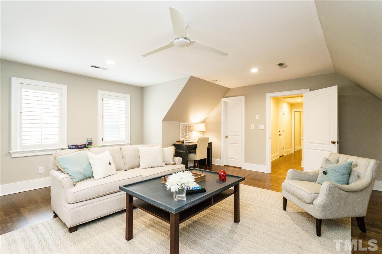 7628 Rainwater Road Raleigh, NC 27615 - Photo 23 of 25 a living room with furniture and a large window