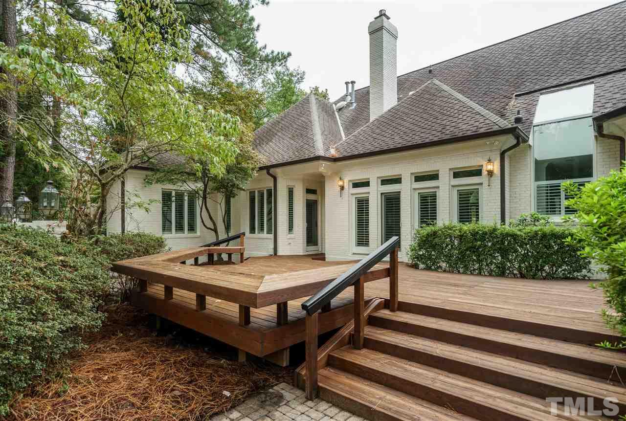 7628 Rainwater Road Raleigh, NC 27615 - Photo 25 of 25 a view of a house with a chairs and table in a patio