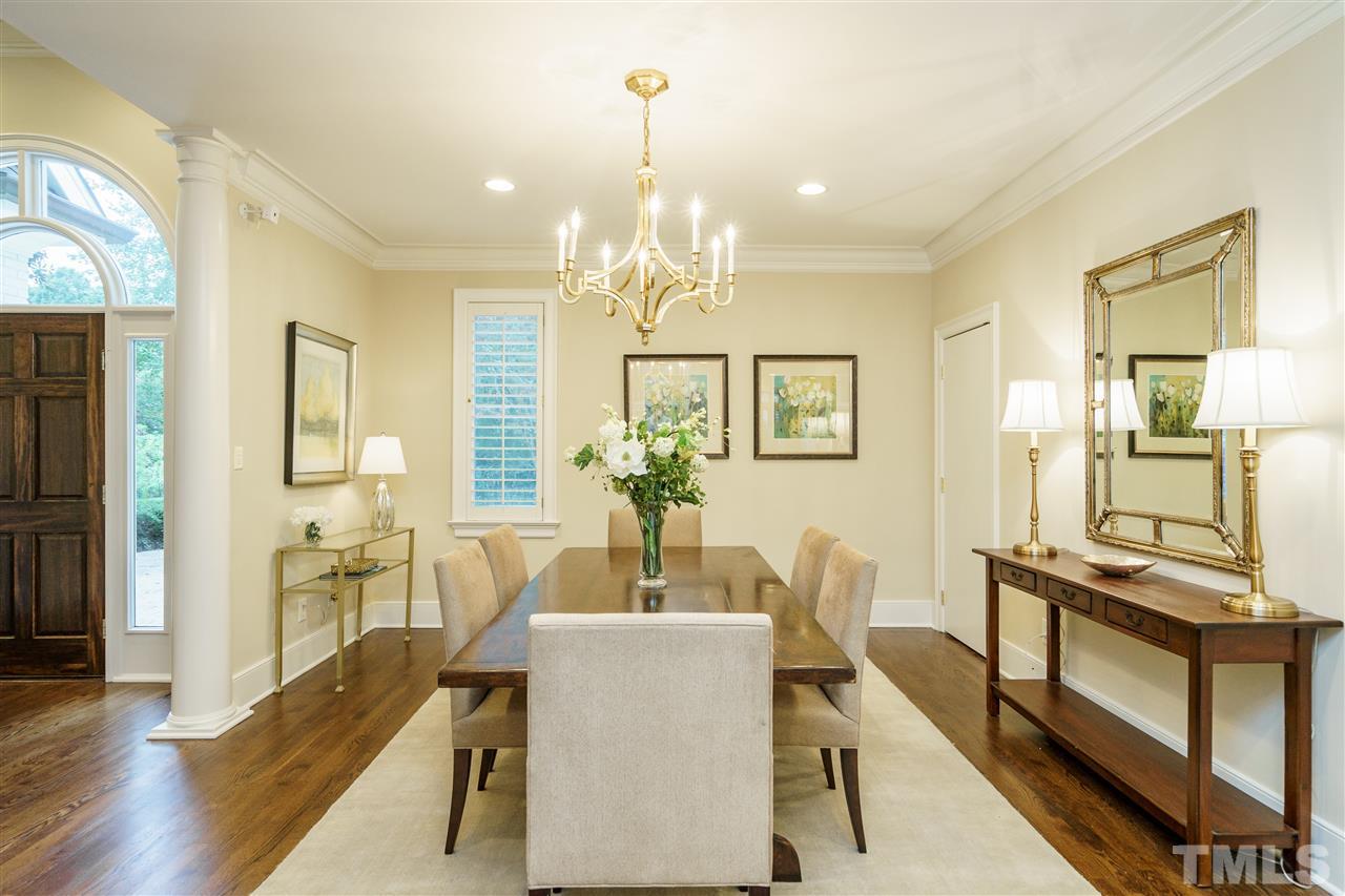 7628 Rainwater Road Raleigh, NC 27615 - Photo 4 of 25 a view of a dining room with furniture window and wooden floor