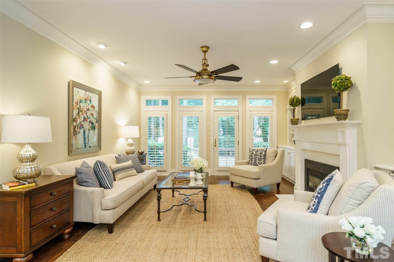 7628 Rainwater Road Raleigh, NC 27615 - Photo 5 of 25 a living room with furniture fireplace and a large window