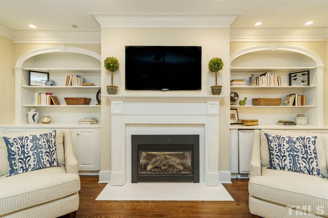 7628 Rainwater Road Raleigh, NC 27615 - Photo 6 of 25 a living room with furniture fireplace and flat screen tv