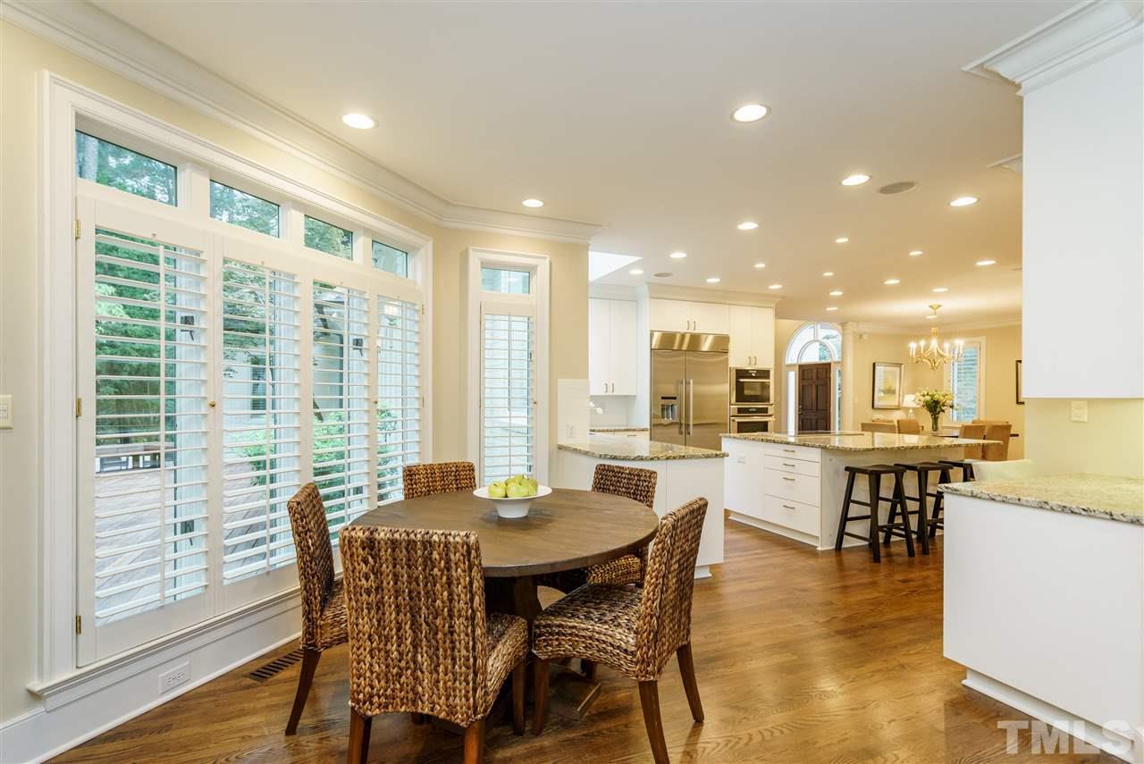 7628 Rainwater Road Raleigh, NC 27615 - Photo 9 of 25 a view of a dining room with furniture window and wooden floor