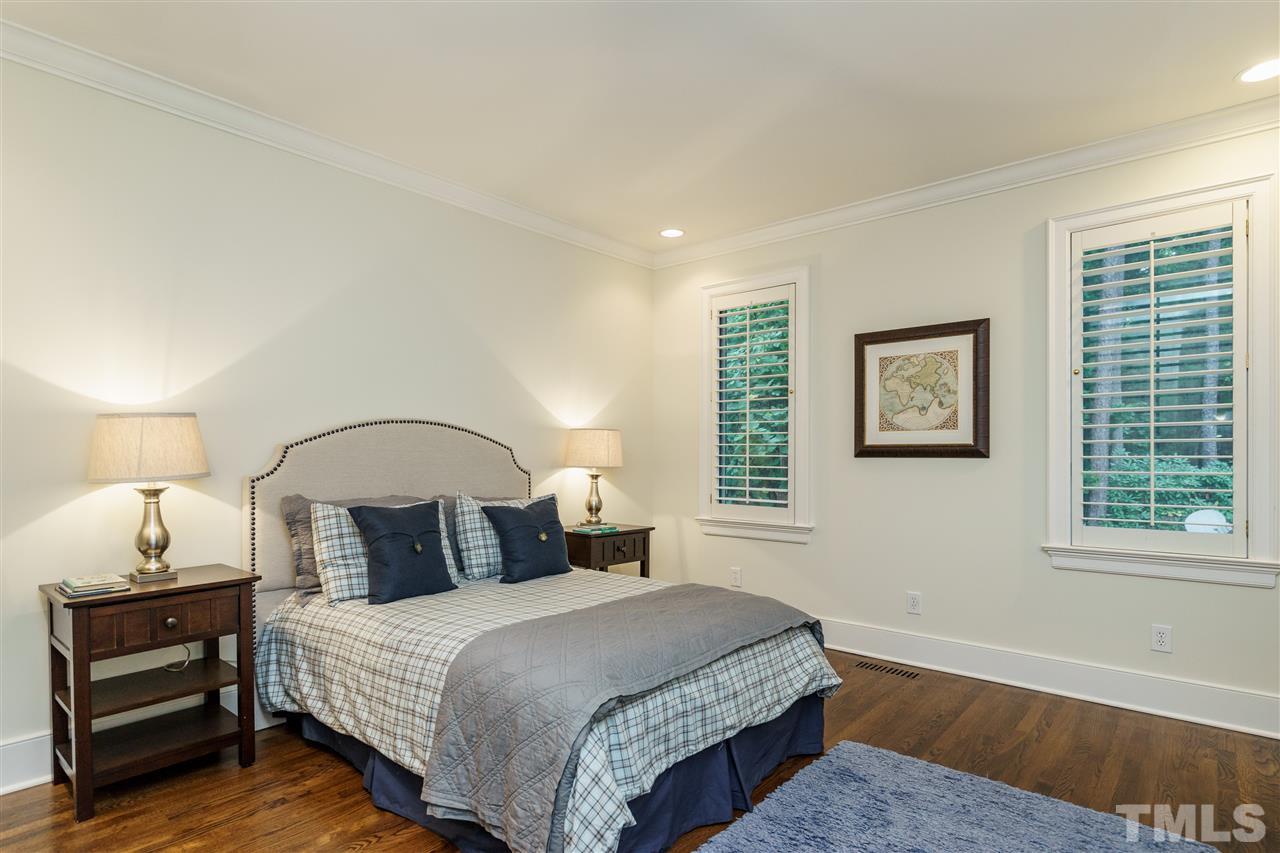 7628 Rainwater Road Raleigh, NC 27615 - Photo 10 of 25 a bedroom with a bed and a window