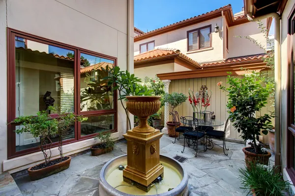 a view of a chairs in patio of the house