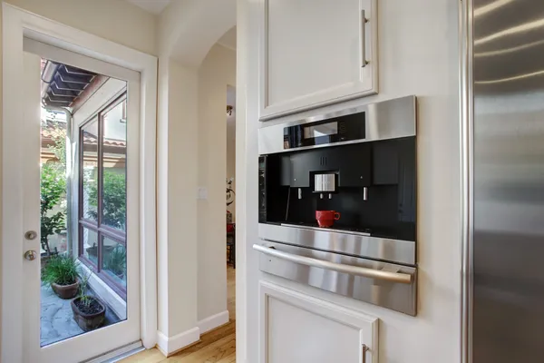 a kitchen with granite countertop a window and a sink