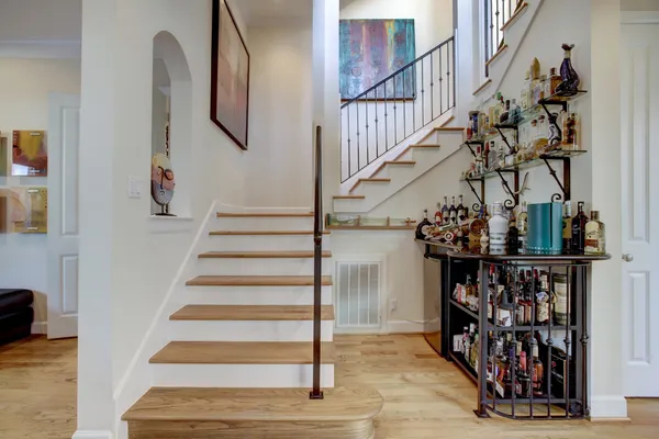 a view of entryway and hall with wooden floor