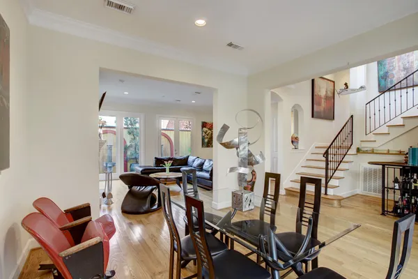 a view of a dining room with furniture and a chandelier