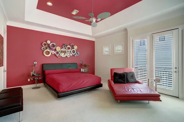 a bedroom with a bed and a couch