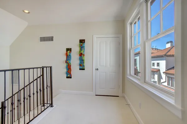a view of an entryway with wooden floor