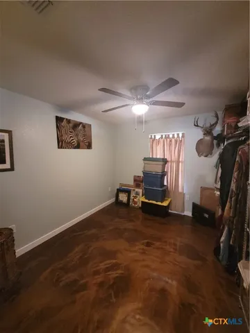 a room with furniture a flat screen tv and a window