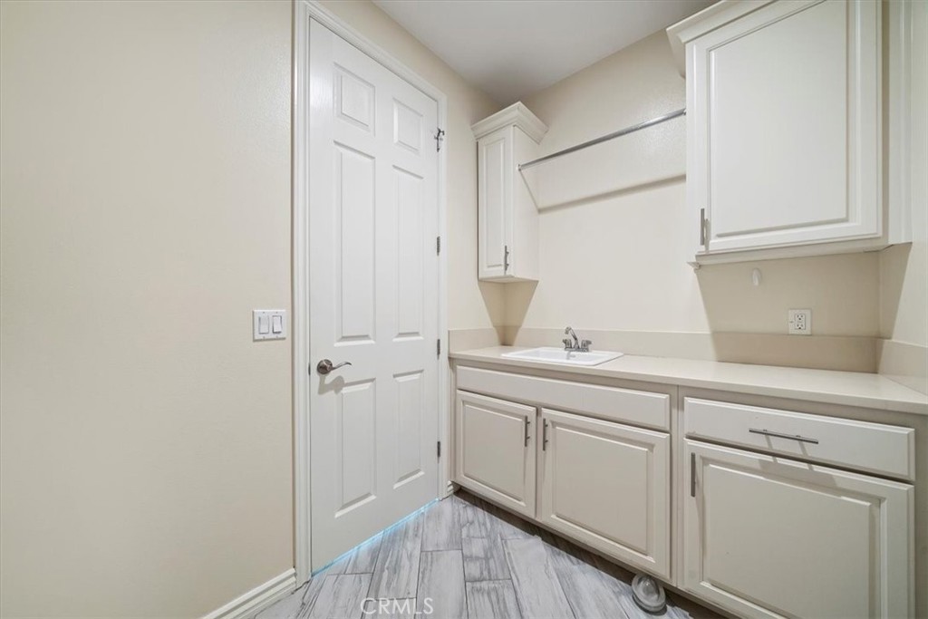 3094 Crystal Ridge Lane Colton, CA 92324 - Photo 15 of 68 a kitchen with a sink and cabinets