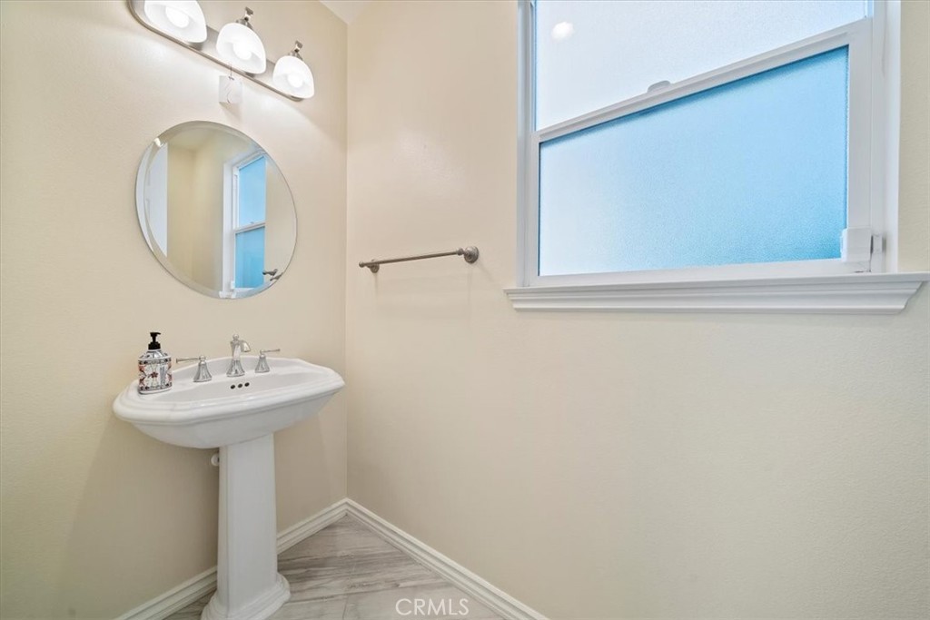 3094 Crystal Ridge Lane Colton, CA 92324 - Photo 16 of 68 a bathroom with a sink and a mirror
