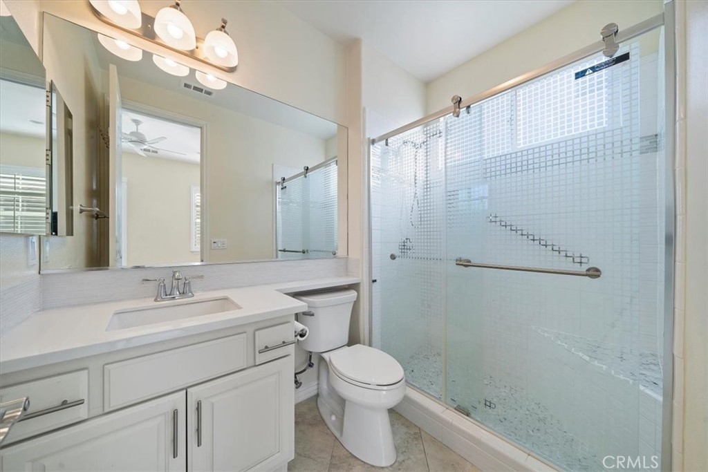 3094 Crystal Ridge Lane Colton, CA 92324 - Photo 19 of 68 a bathroom with a sink a toilet and shower