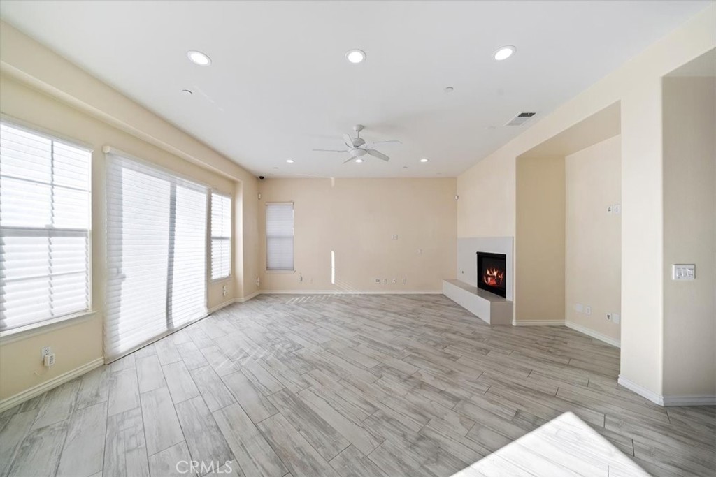 3094 Crystal Ridge Lane Colton, CA 92324 - Photo 24 of 68 a view of an empty room with wooden floor and a window