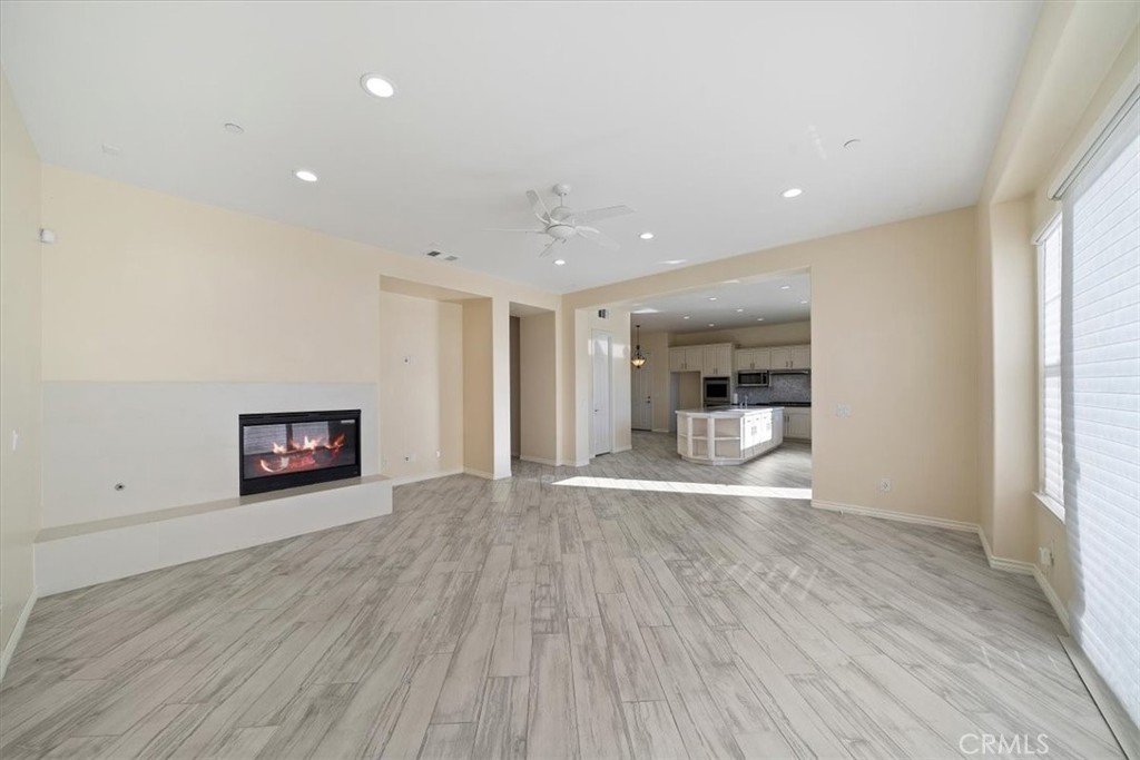 3094 Crystal Ridge Lane Colton, CA 92324 - Photo 26 of 68 a view of a big room with wooden floor and a window