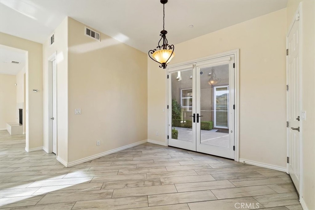 3094 Crystal Ridge Lane Colton, CA 92324 - Photo 35 of 68 a view of a room with wooden floor and door