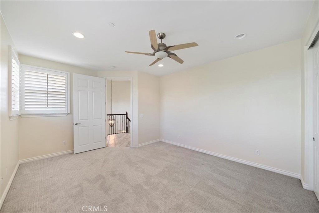 3094 Crystal Ridge Lane Colton, CA 92324 - Photo 38 of 68 wooden floor in an empty room with a window
