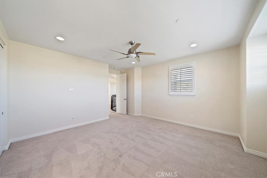3094 Crystal Ridge Lane Colton, CA 92324 - Photo 45 of 68 a view of an empty room with a ceiling fan