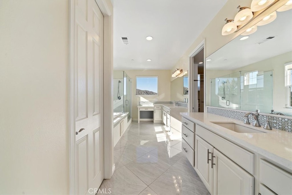 3094 Crystal Ridge Lane Colton, CA 92324 - Photo 50 of 68 a bathroom with a double vanity sink and a mirror