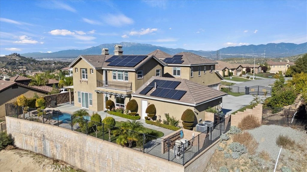 3094 Crystal Ridge Lane Colton, CA 92324 - Photo 66 of 68 an aerial view of a house with a big yard