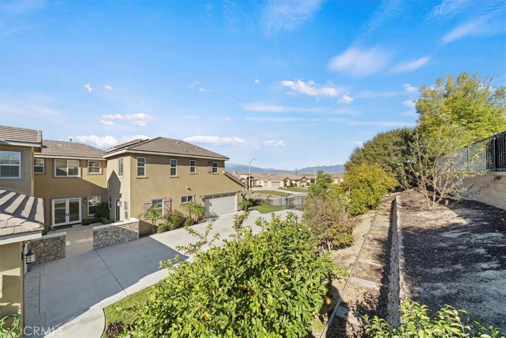 3094 Crystal Ridge Lane Colton, CA 92324 - Photo 9 of 68 a front view of a house with a yard