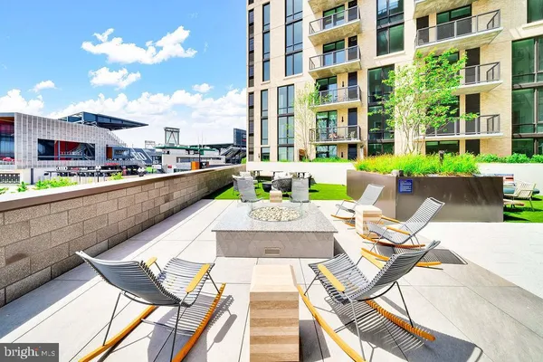 a view of a chairs and table in patio