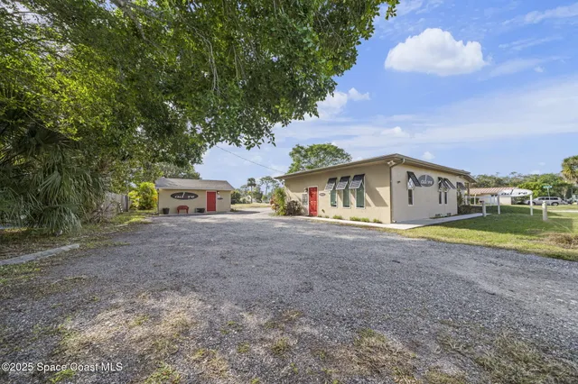 a view of house with outdoor space and swimming pool