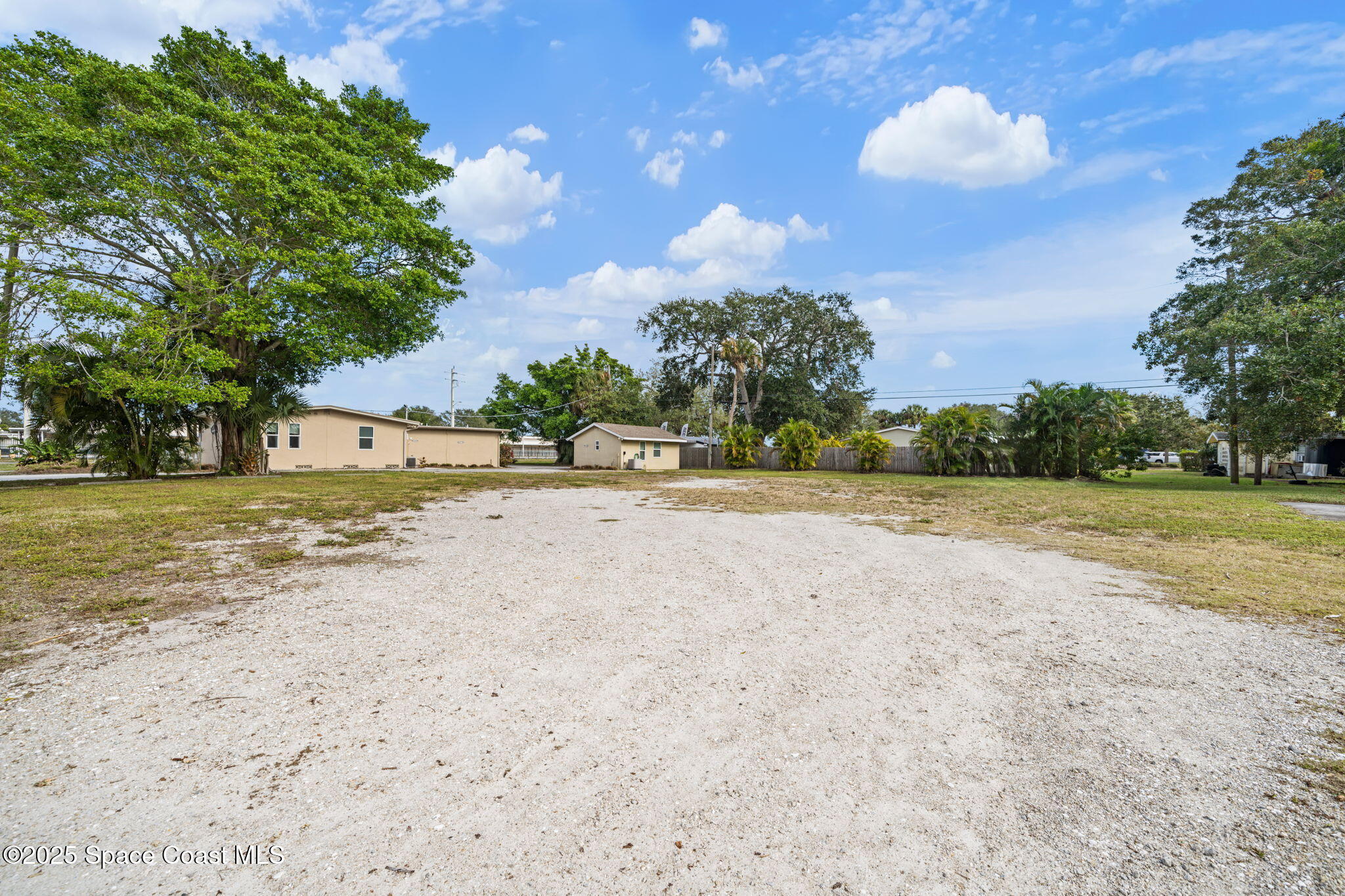 290 Parnell Street Merritt Island, FL 32953 - Photo 12 of 48 a view of yard with swimming pool and green space