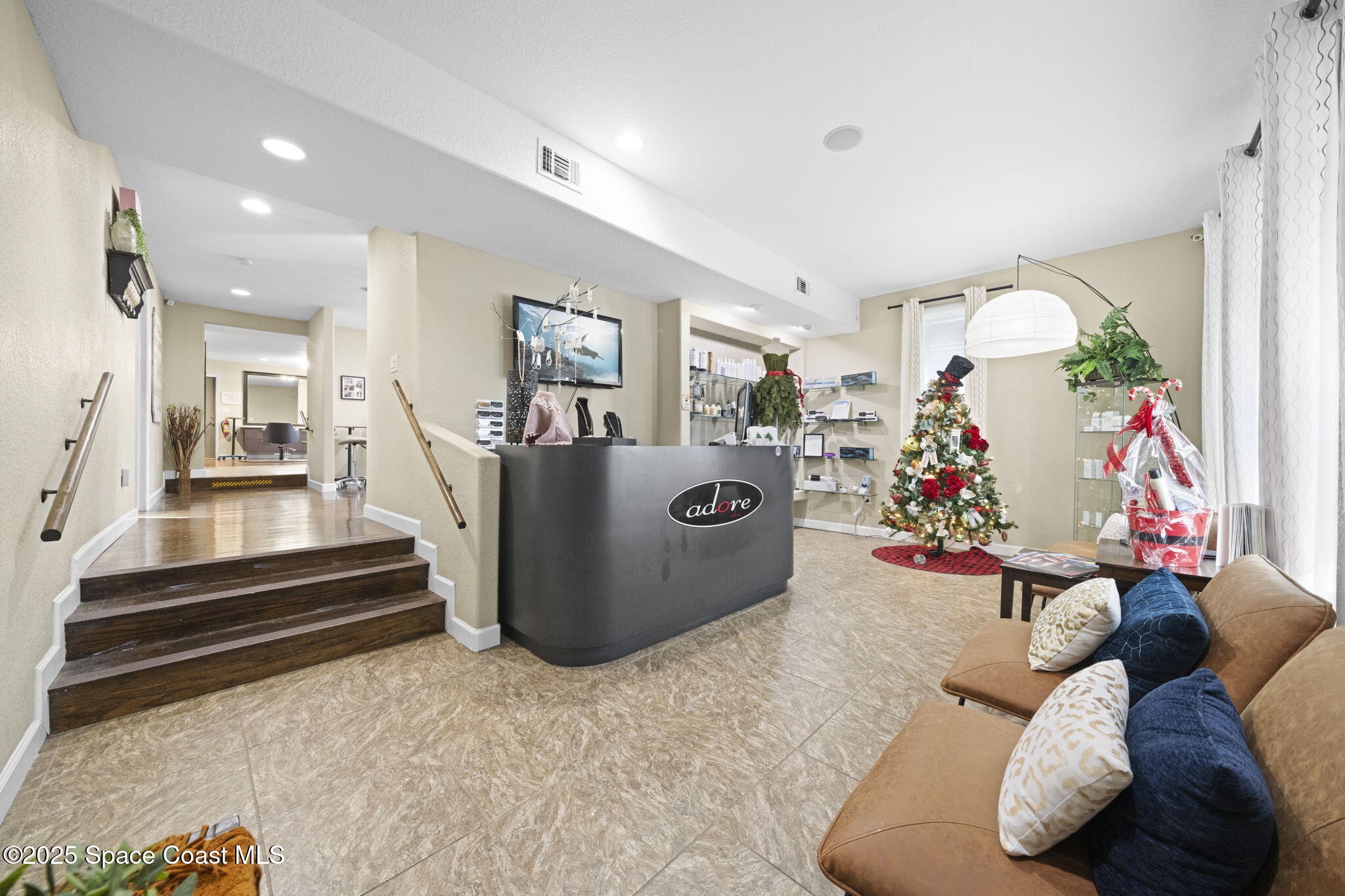 290 Parnell Street Merritt Island, FL 32953 - Photo 13 of 48 a living room with furniture and a chandelier