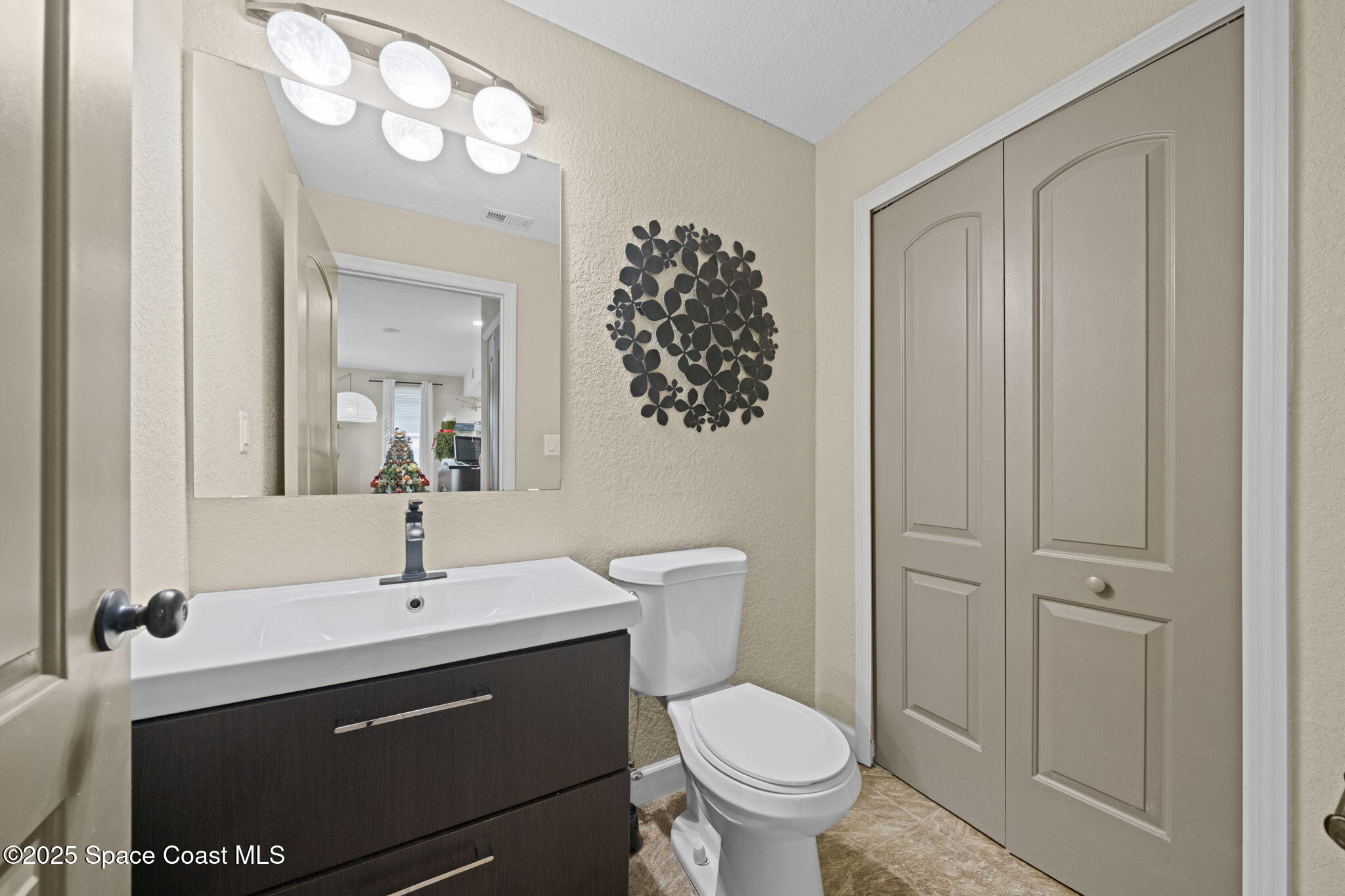 290 Parnell Street Merritt Island, FL 32953 - Photo 18 of 48 a bathroom with a sink a toilet and shower