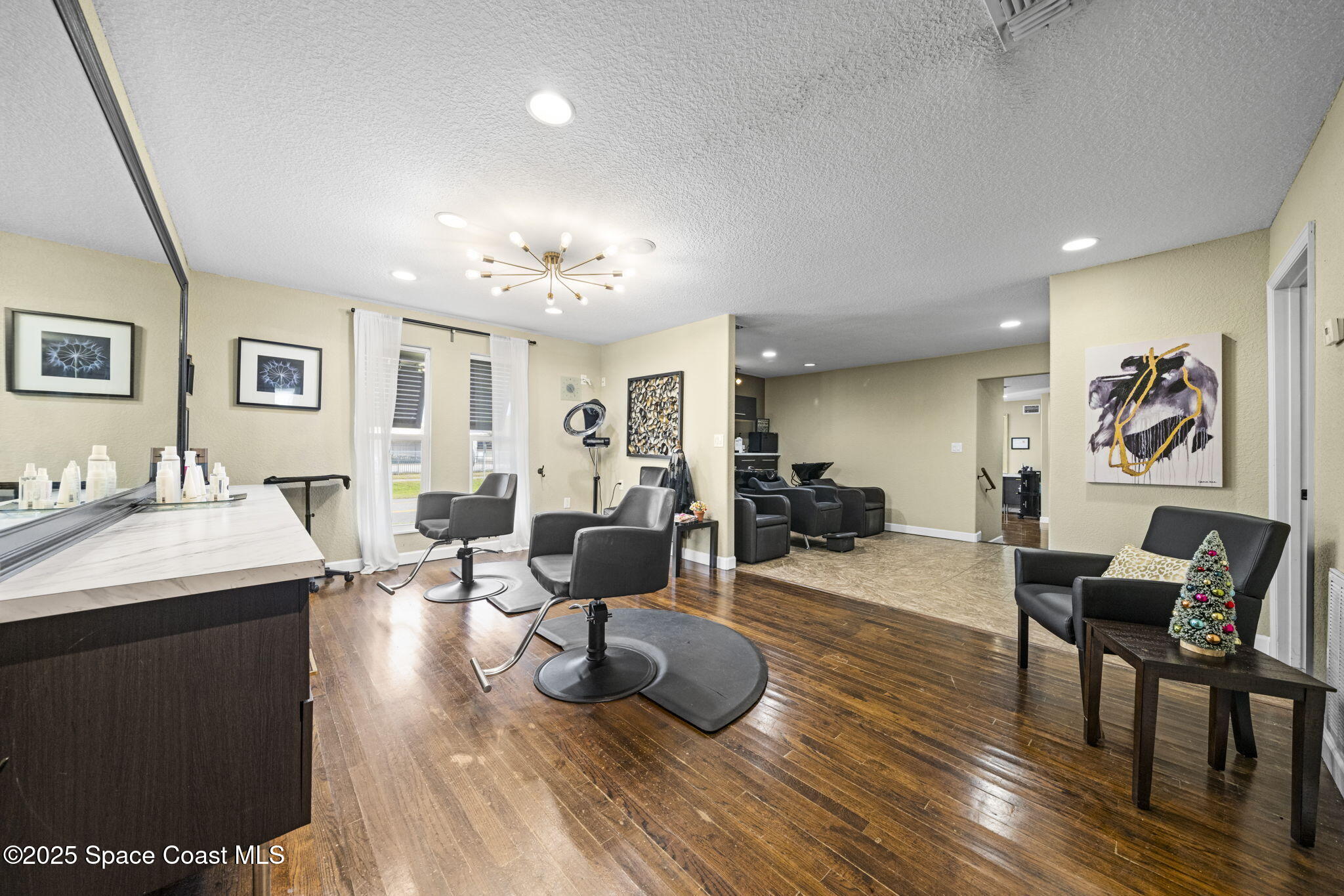 290 Parnell Street Merritt Island, FL 32953 - Photo 26 of 48 a living room with furniture a dining table and wooden floor