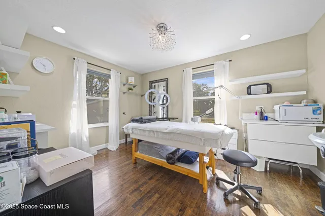 a bedroom with a bed and a desk in it