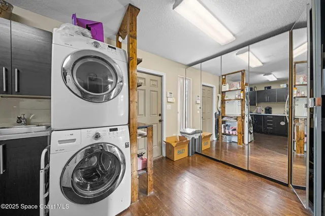 a view of a hallway with washer and dryer
