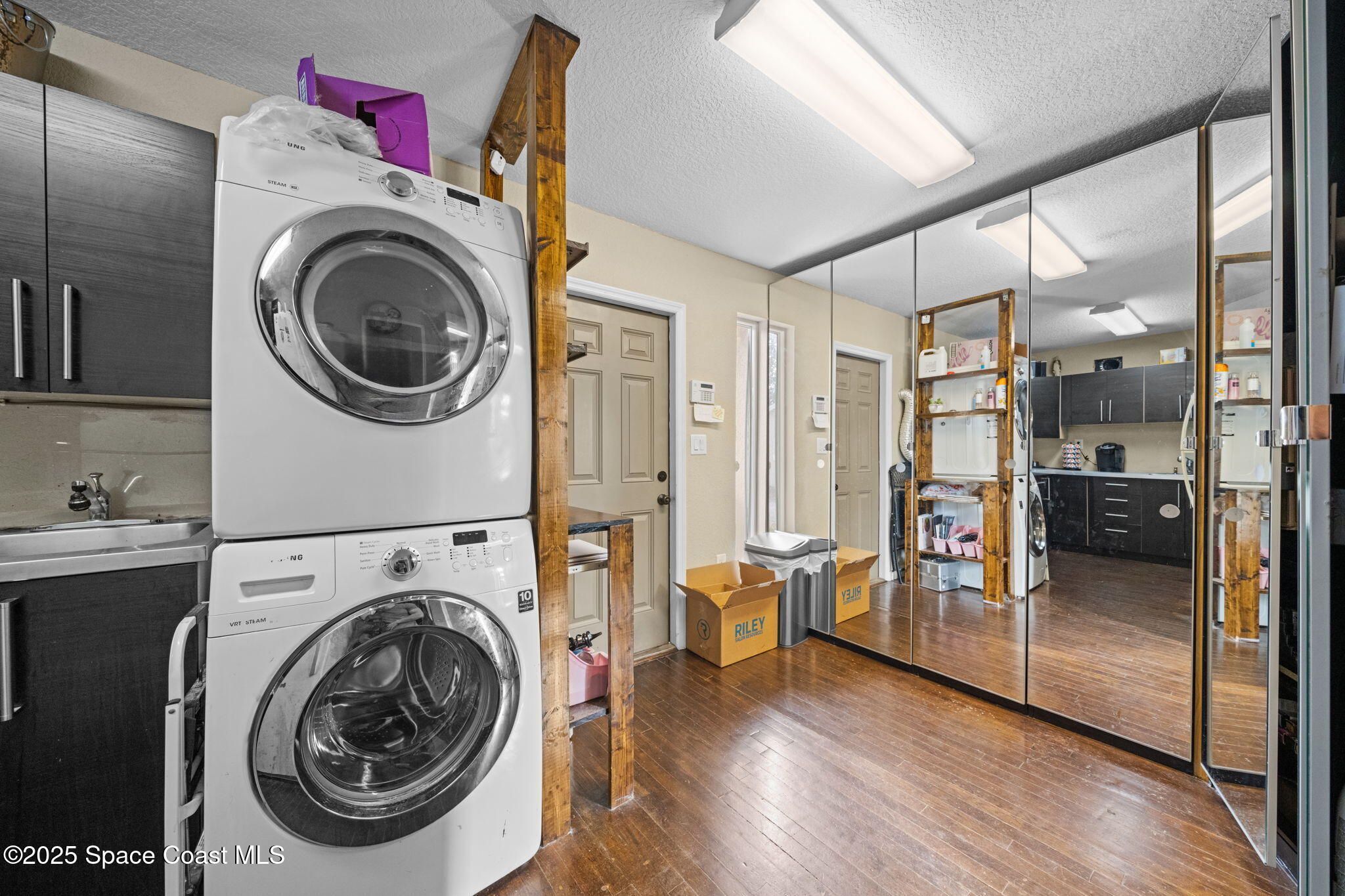 290 Parnell Street Merritt Island, FL 32953 - Photo 39 of 48 a view of a hallway with washer and dryer