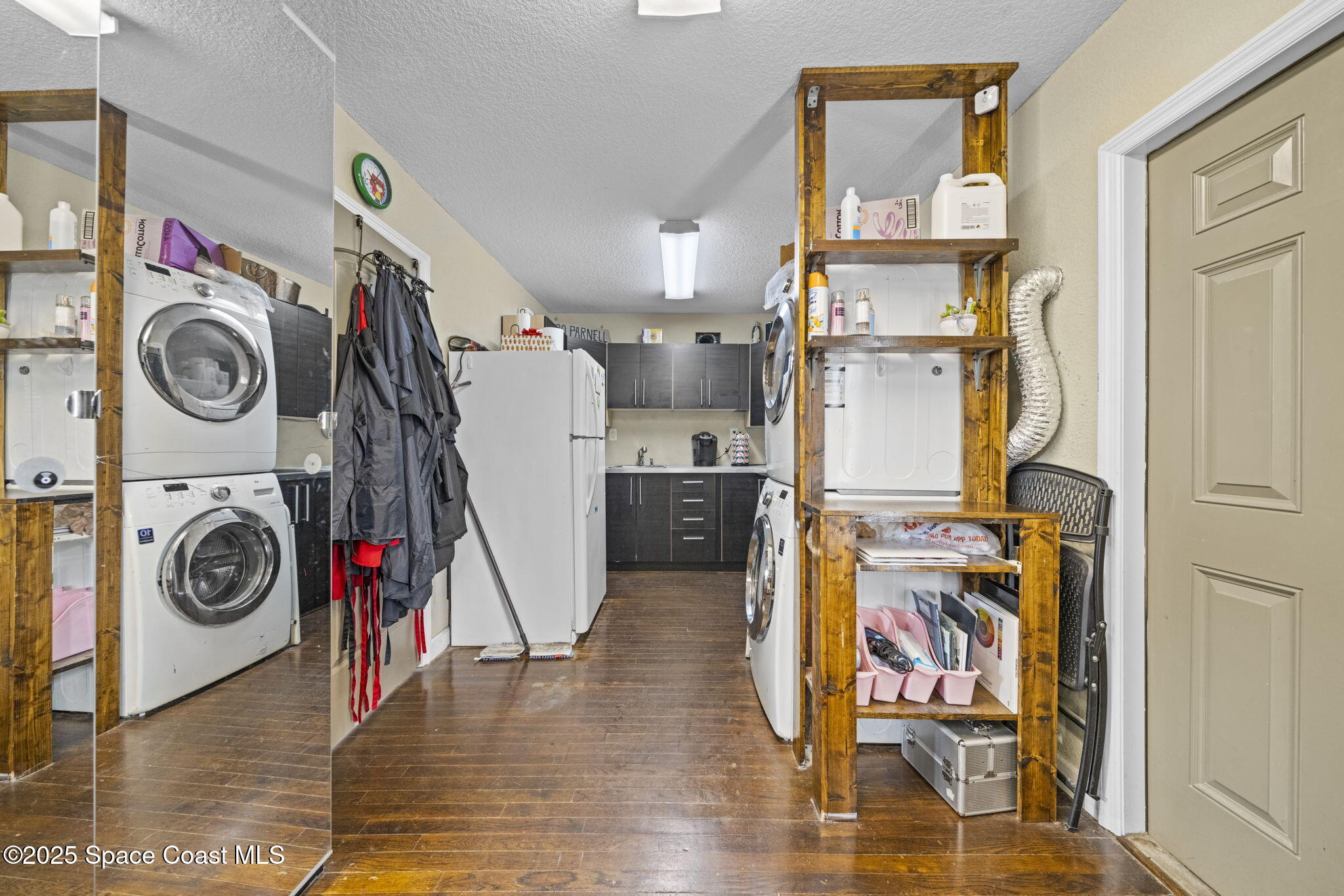 290 Parnell Street Merritt Island, FL 32953 - Photo 40 of 48 a view of a storage and utility room with washer and dryer