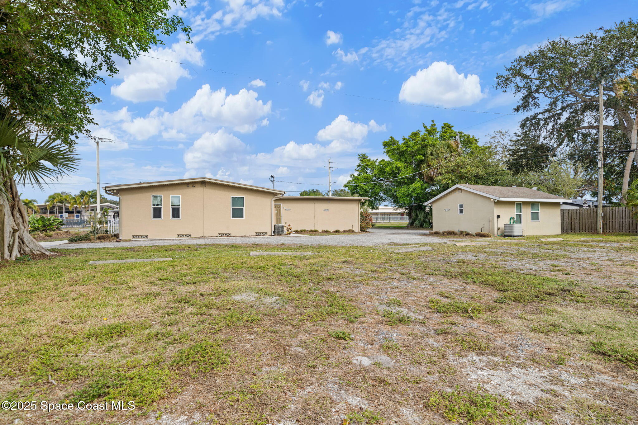 290 Parnell Street Merritt Island, FL 32953 - Photo 8 of 48 a front view of house with yard and trees in the background