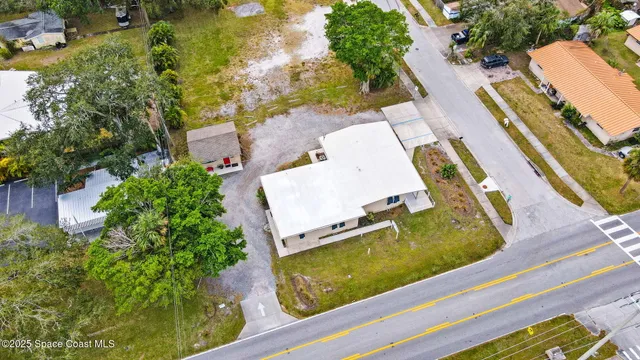 an aerial view of house with a swimming pool