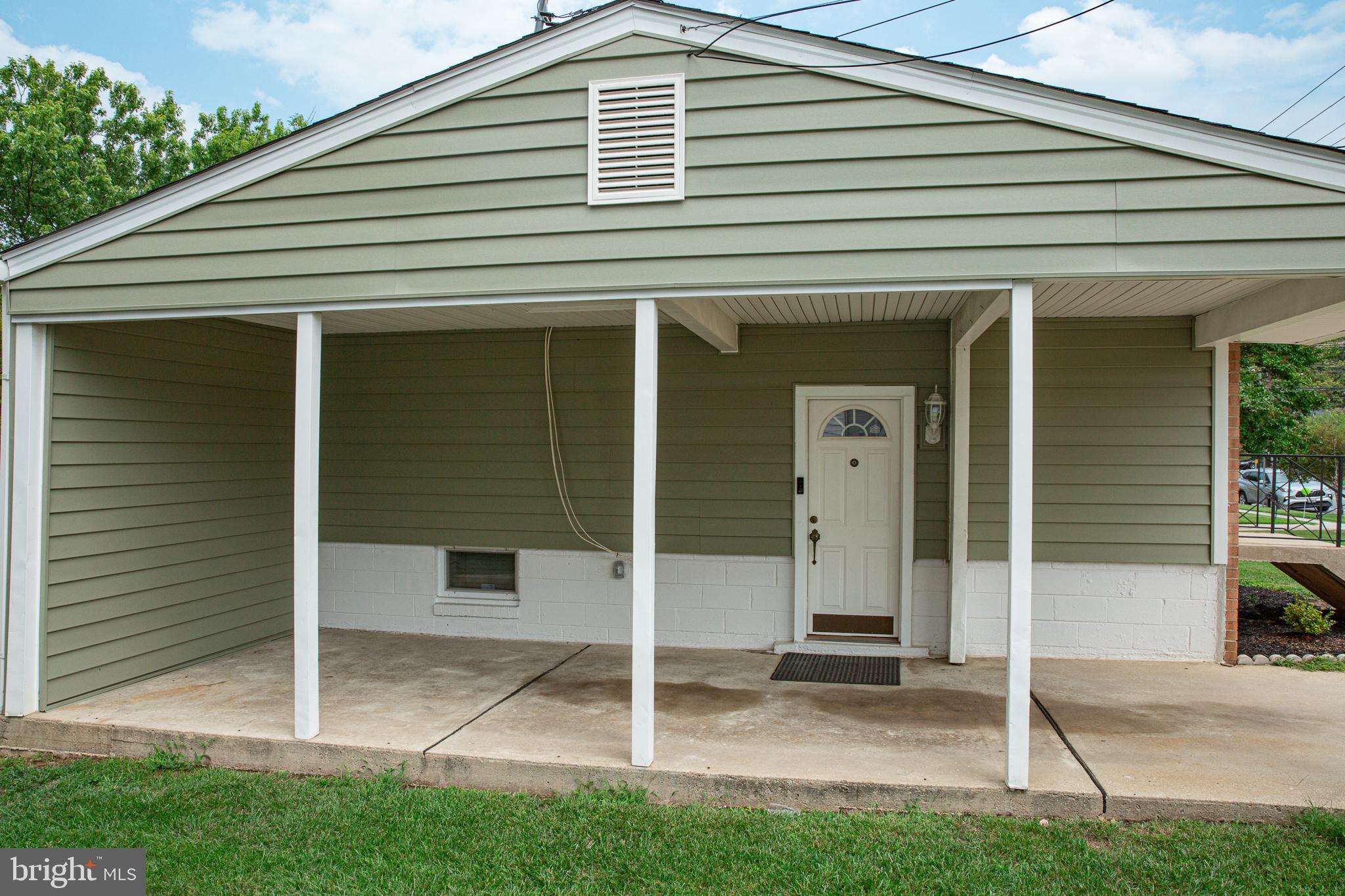 7110 Good Luck Road Hyattsville, MD 20784 - Photo 3 of 46 Carport/Driveway and side entrance