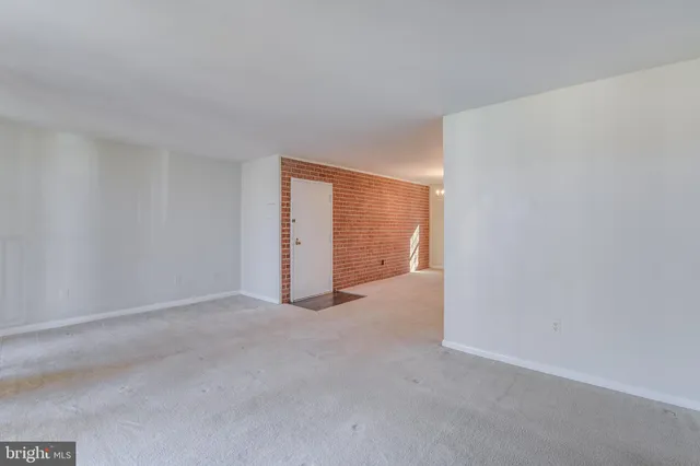 a view of an empty room and closet