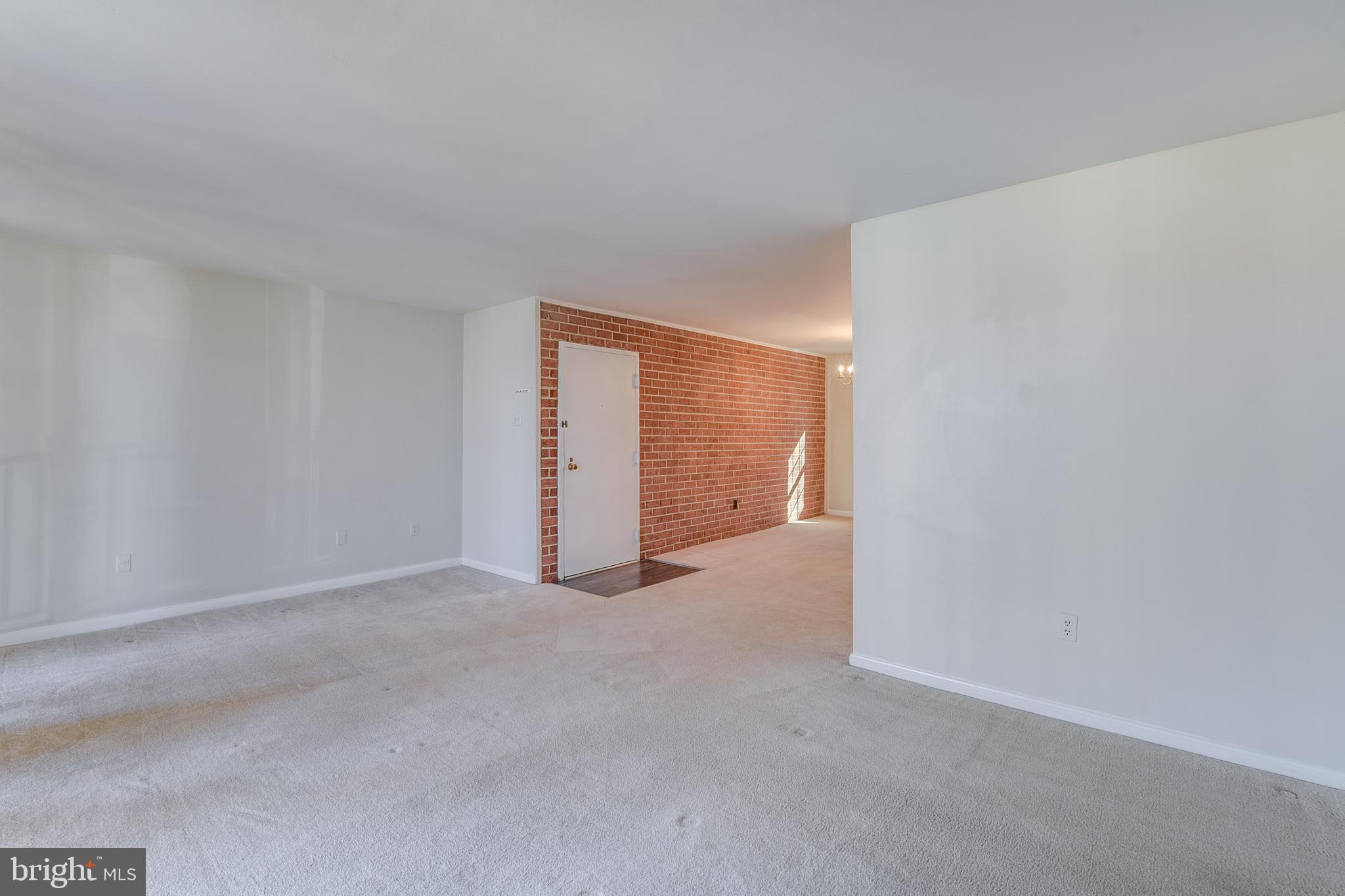 762 Quince Orchard Boulevard, Unit 101 Gaithersburg, MD 20878 - Photo 3 of 21 a view of an empty room and closet