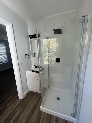 a bathroom with a sink and shower