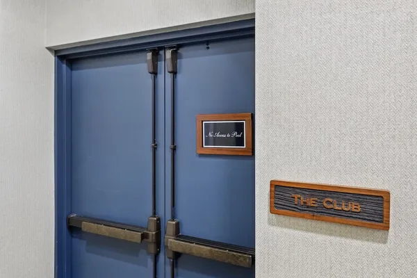 a kitchen with a refrigerator sink and cabinets