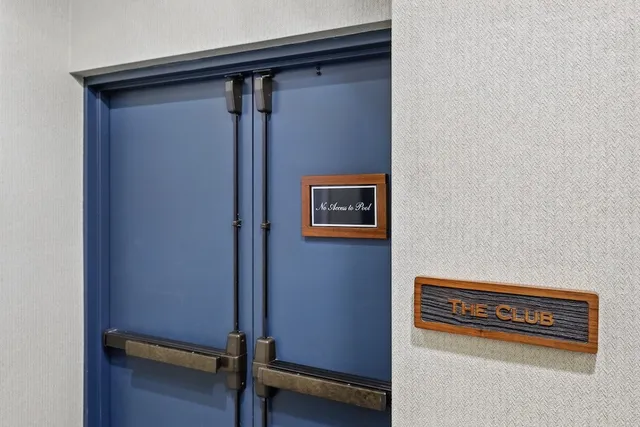 a kitchen with a refrigerator sink and cabinets