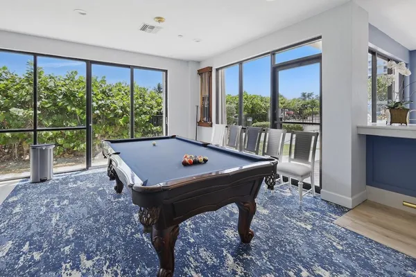 a view of a dining room with furniture window and outside view