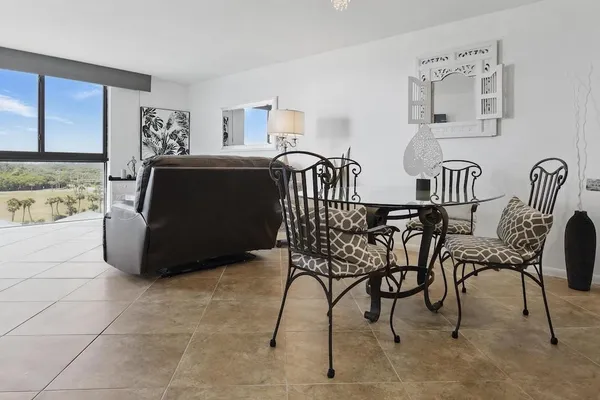 a kitchen with stainless steel appliances granite countertop a refrigerator sink and stove