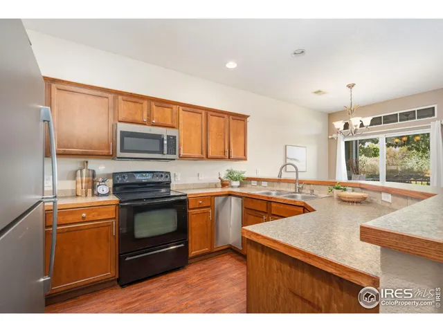 a kitchen with a stove a sink and a microwave