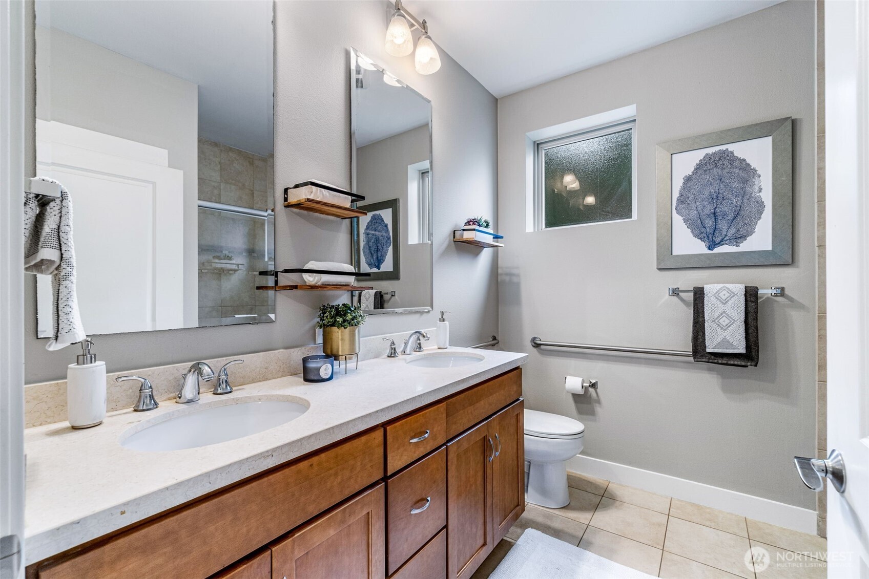 15700 116th Avenue Northeast, Unit 102A Bothell, WA 98011 - Photo 17 of 35 a bathroom with a granite countertop sink mirror vanity and toilet
