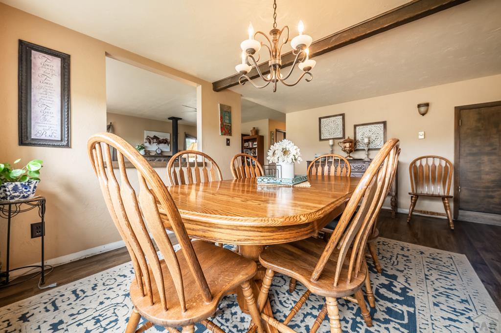 8419 3 R Road Beulah, CO 81023 - Photo 11 of 46 a dining room with furniture and chandelier