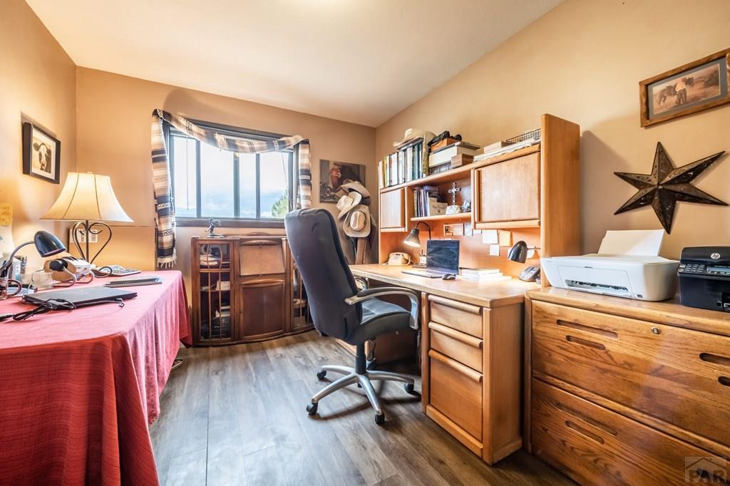 8419 3 R Road Beulah, CO 81023 - Photo 19 of 46 a view of a workspace with furniture and a window