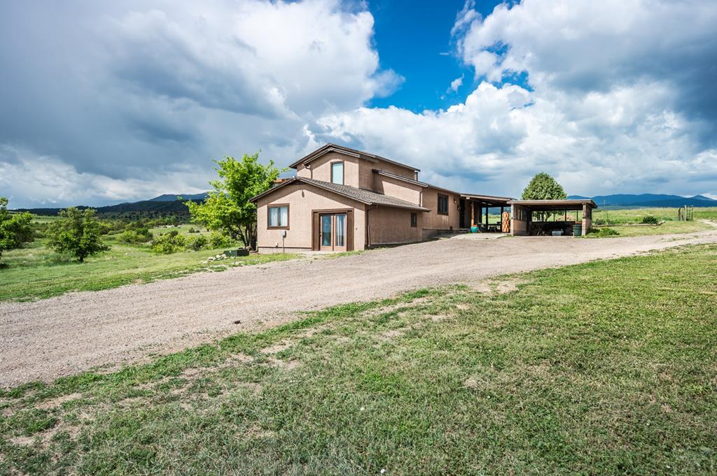 8419 3 R Road Beulah, CO 81023 - Photo 2 of 46 a view of house with yard and car parked